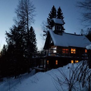 Log cabin in the snowy mountains