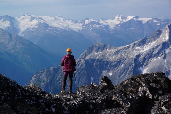 Hiking standing along ridge of mountain