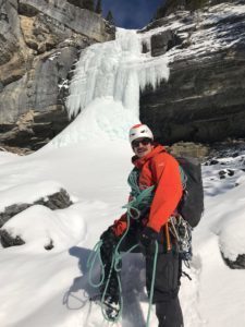 tim1 a man standing on top of a snow covered mountain