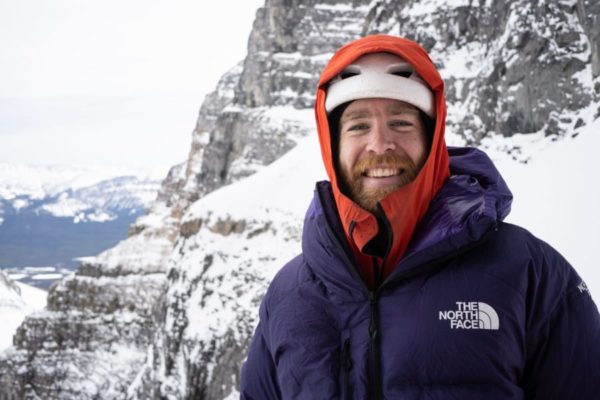 Maarten a man standing on top of a snow covered mountain